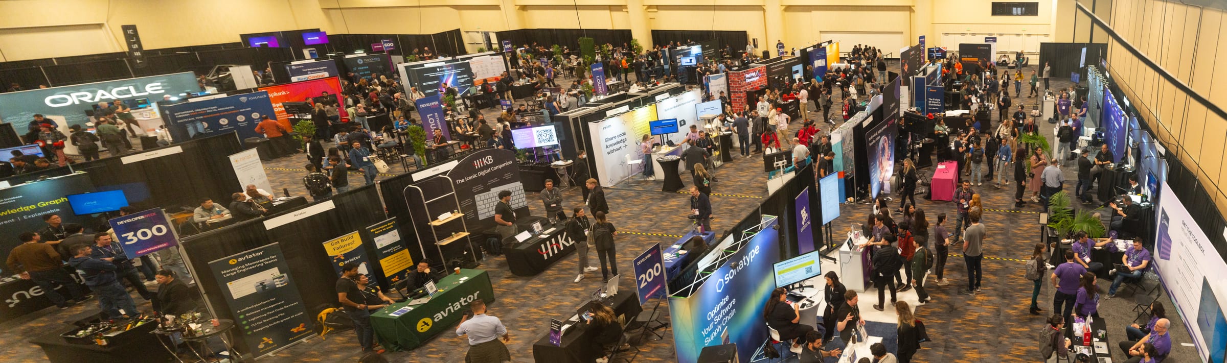 Wide overhead view of the API World 2026 expo floor with vendor booths and attendees
