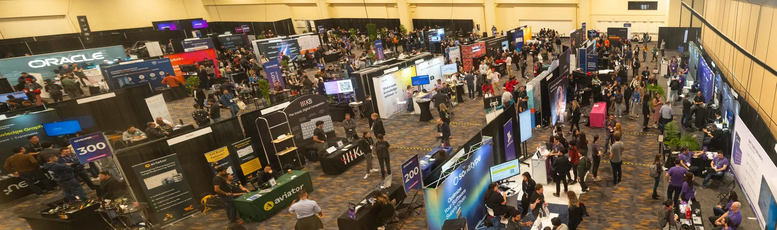 Wide overhead view of the API World 2026 expo floor with vendor booths and attendees