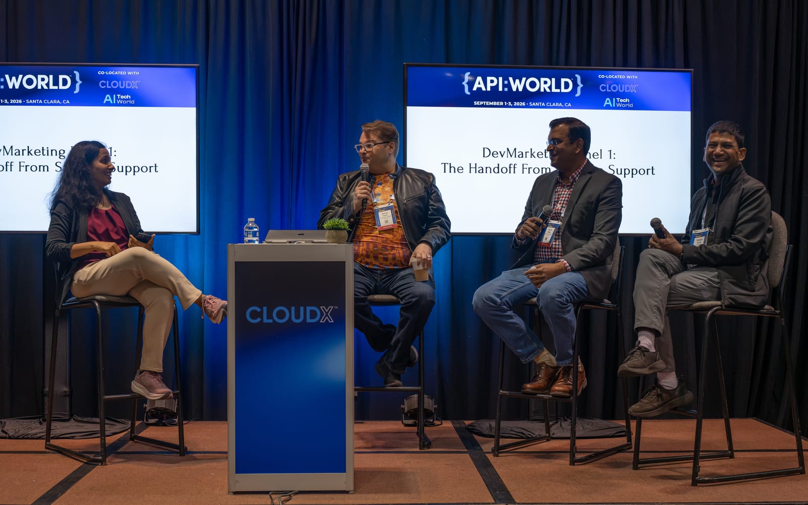 Four panelists seated on the CloudX Expo Stage for the DevMarketing panel on the handoff from sales to support at API World 2026